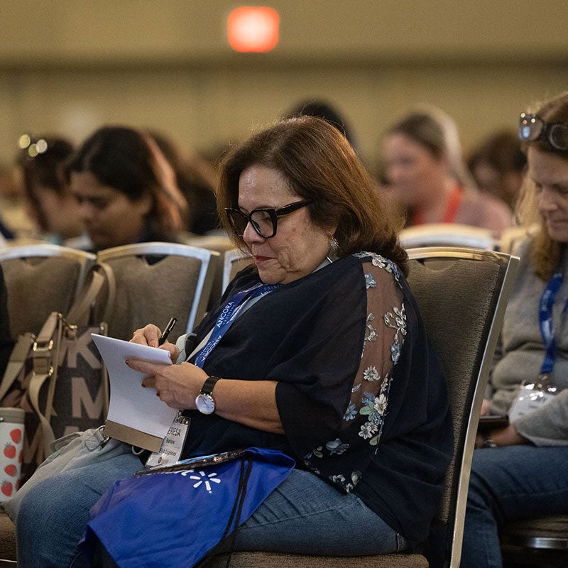 2024-Accelerate-Conference-Attendee-Taking-Notes-800x800