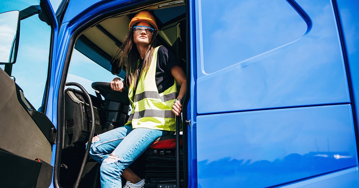 young-female-driver-blue-truck-1200x630